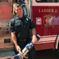 Firefighter holding rescue tool